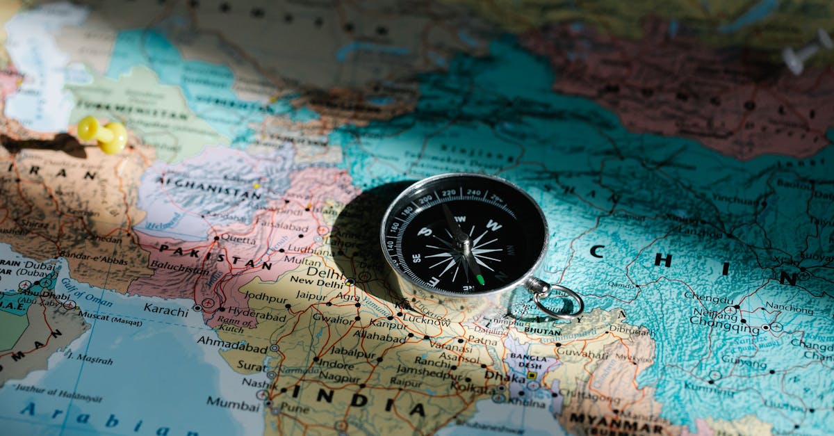 China to India Shipping Cost - Close Up Image Of Compass On A World Map Highlighting Travel Direction And Exploration
